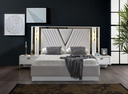 2-bedroom bed with gold trim and matching bedside tables